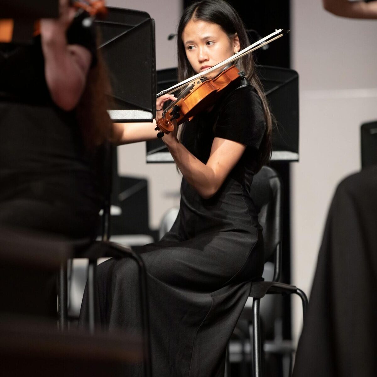 girl practicing violin